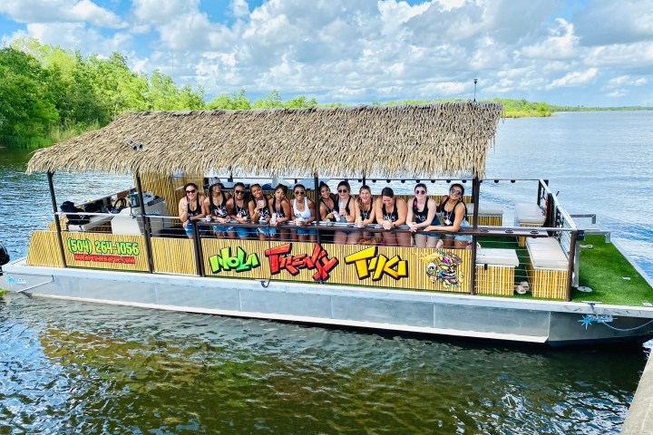 a group of people in a boat on a body of water