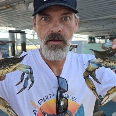 a man holding a crab